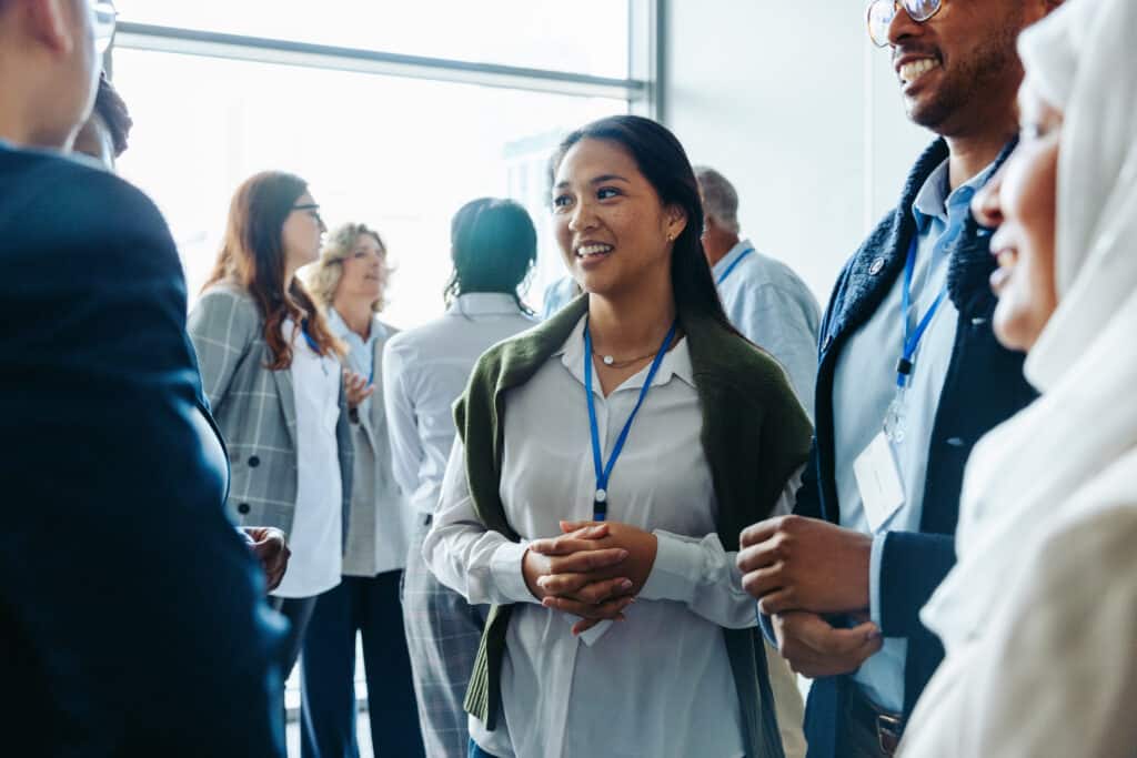 Diverse professionals networking at an industry event